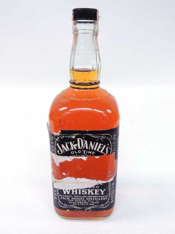 1981 Jack Daniels Bottle: 1 liter Front label is torn & seal is worn. If you require shipping, please talk to Ian before bidding.