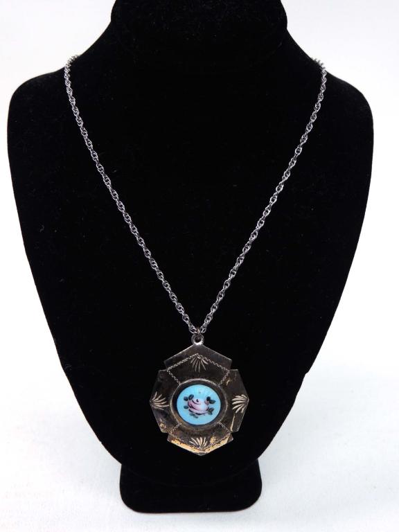 Sterling silver locket: Sterling silver locket with rose enamel on top.
