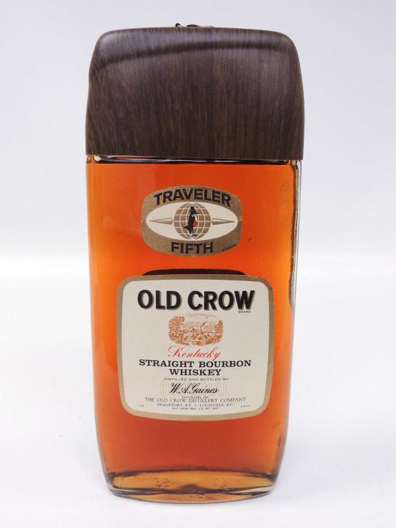 Old Crow Traveler Fifth 1968 Whisky Bottle: 4 year old. 86 Proof. Sealed. 4/5 qt. Strap and bottle are in excellent condition. Estimated sale time: 7:04pm, CST