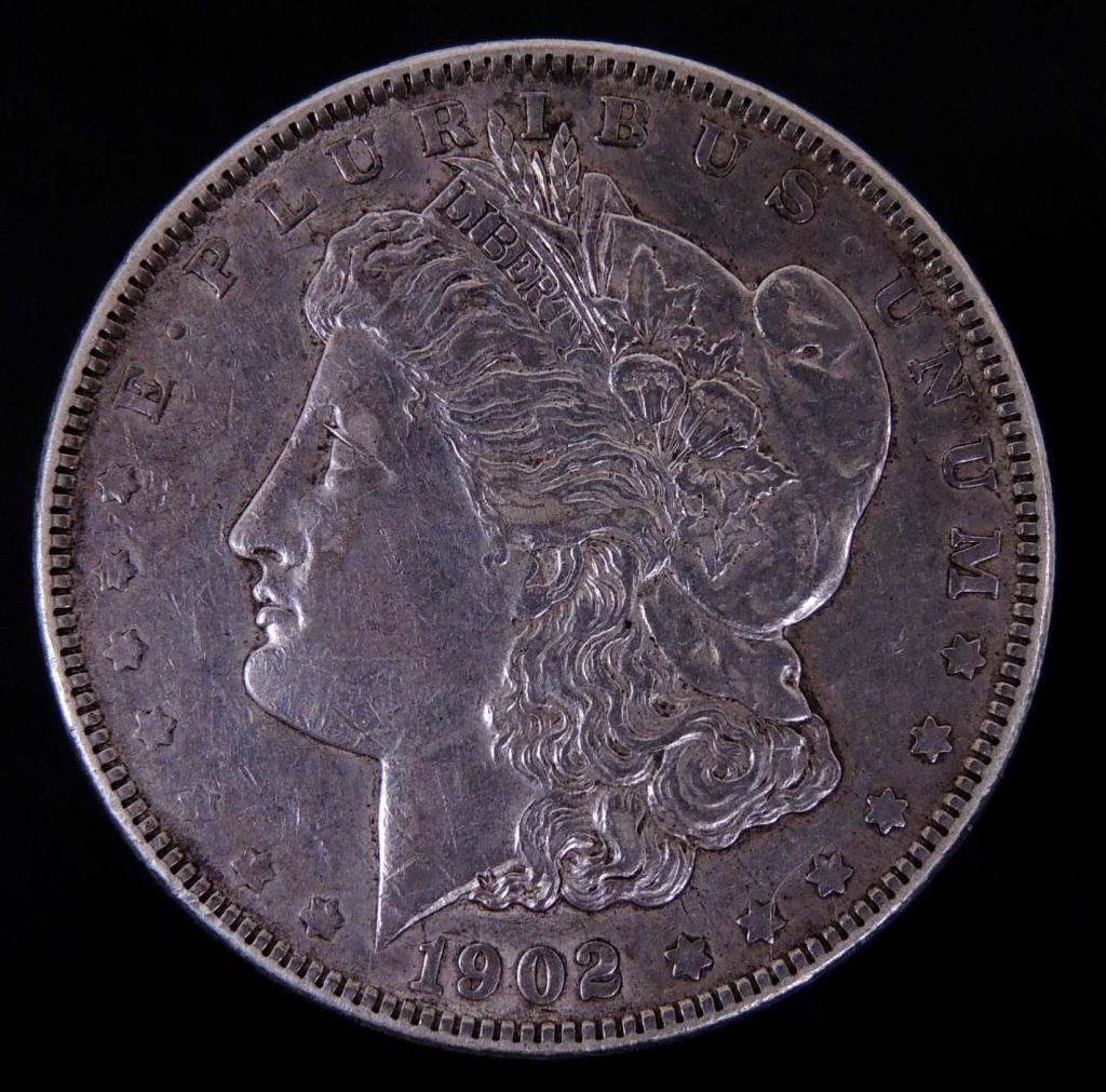 1902 Morgan silver dollar: 1902 Morgan silver dollar (Philadelphia mint). Reported by consignor as Choice BU.