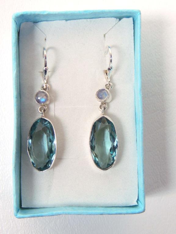 Sterling Silver Earrings: Dangling sterling silver earrings with lever backs and set with quartz aqua marine gemstones and moonstone accents.