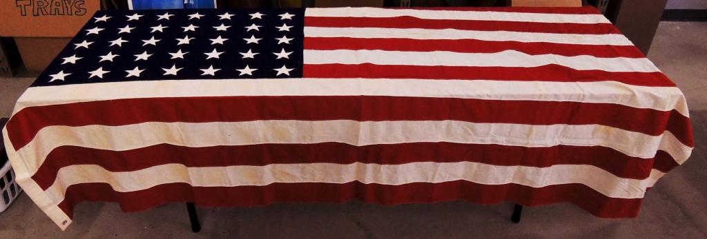 48 Star Flag: 5' x 9.5'. There is a faint stencil on the hoist which we think reads "united service flag co nyc".