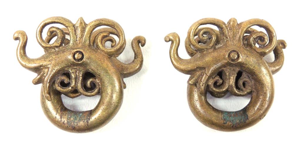 Dayak Tribal Brass Earrings: From Miri, Sarawak. 75+ years old. Indonesian Borneo, Dayak tribes. Aso pattern represents a dog-dragon or goddess of the underworld, who controlled agriculture and fertility. 1.5 x 2"