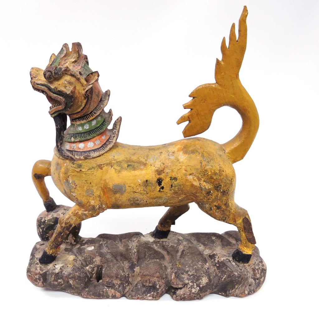 Burmese Chinthe - Yellow Carved Wood Animal: In the late 19th Century, many traders in Burma would add animal or spirit images to adorn their two-wheeled carts to protect the owner and their goods. The Singha (Thai Lion-ruler of the land) and Na