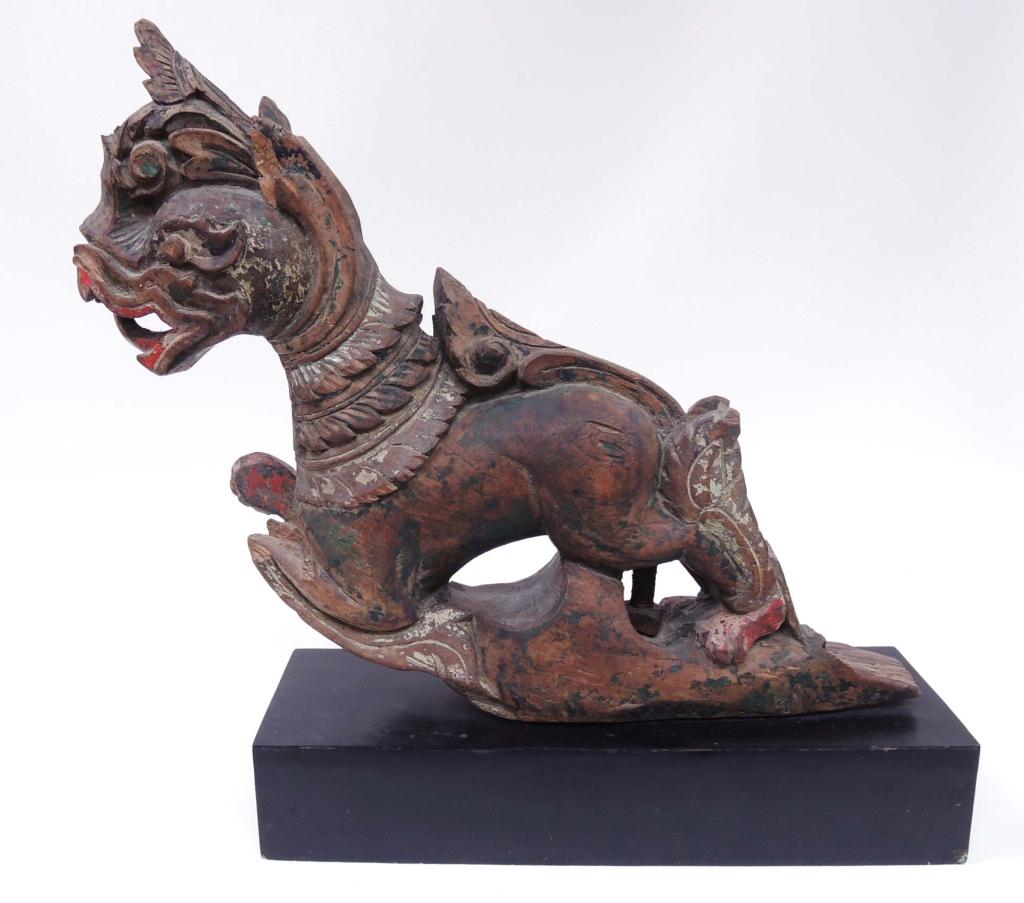 Burmese Singha - Carved teak Buffalo-Cart Ornament: In the late 19th Century, many traders in Burma would add animal or spirit images to adorn their two-wheeled carts to protect the owner and their goods. The Singha (Thai Lion-ruler of the land) and Na
