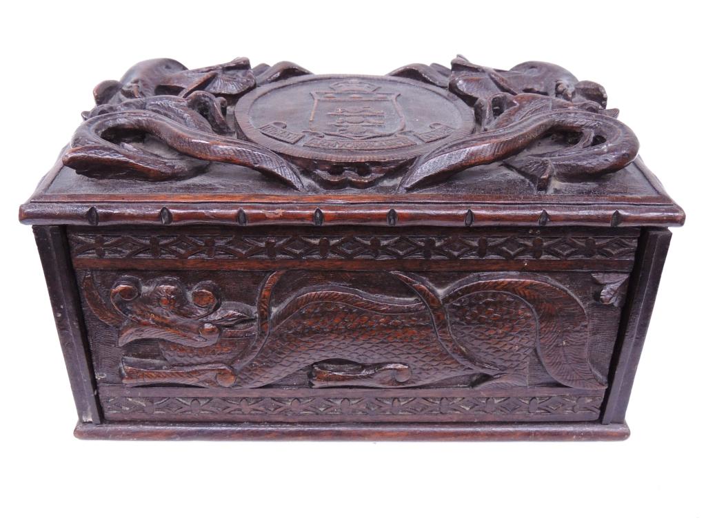 WWII Trench Art Wooden Cigarette Box: WWII Trench Art Wooden Cigarette Box. Wood, Indian Ordinance Corps insignia, "Lt. Col. D. B. Rai," carved with dragons. 5"x8"x5". Empty box of Sundari safety matches.