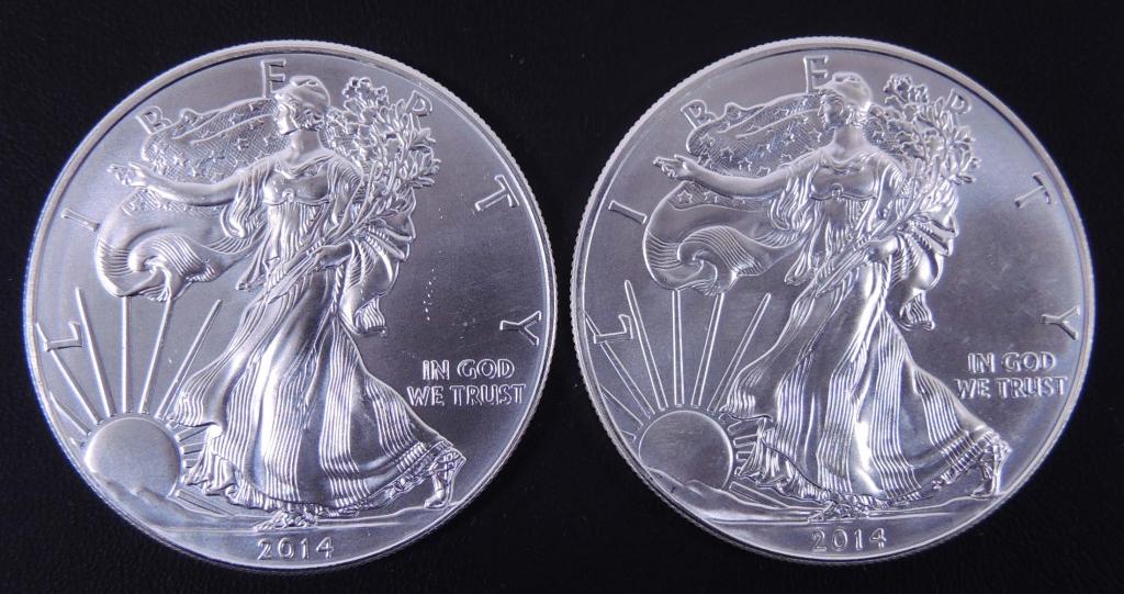 2014 BU Silver Eagles (2): (2) 2014 brilliant uncirculated $1 Silver Eagle bullion coins. 1 troy ounce of 0.999 fine silver in each.