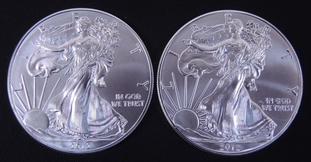2012 BU Silver Eagles (2): (2) 2012 brilliant uncirculated $1 Silver Eagle bullion coins. 1 troy ounce of 0.999 fine silver each.