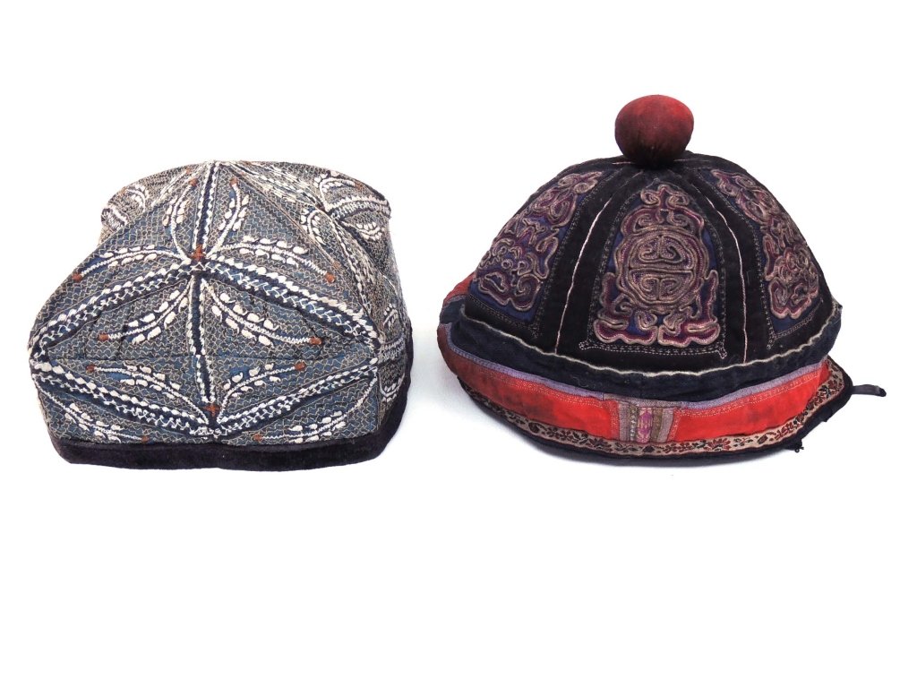 Miao Tribe Boys' Winter Hats (4): 1. Miao young boy's winter hat. Made in Shidong Township - Guizhou Province, China. Black velvet with two red chickens.2. Miao boy's winter hat. Made by Miao tribe in Shidong Township, Taijiang County