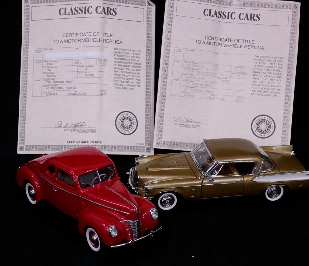 Model Cars (2): 1957 Studebaker Golden Hawk, Danbury Mint. Box: 11" x 6" x 5 1/4". 1940 Ford Deluxe Coupe, Danbury Mint. Box: 10.5" x 5.25" x 4 1/8". Both 1:24 model cars in original boxes (one closure tab broken, bu