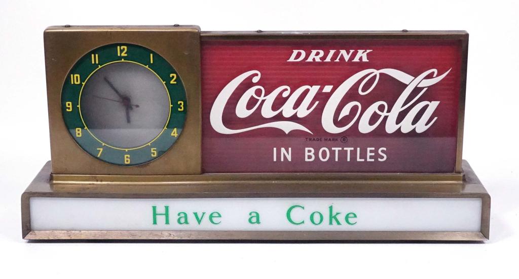 Coca-Cola Table Mantle Light-up Clock: Mid-century Coca-Cola table mantle light-up clock. 19 3/8" x 4 3/4" x 8 3/4", 12 lbs. Price Brother Manufacturing. Clock is functioning. Light does not light.