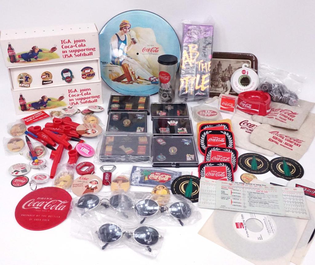 Coca-Cola Smalls Lot: Pins, patches, ice pick, tray, bottle opener, ashtray, sunglasses, bottlecaps, (2) 45 rpm records of advertising jingles (1969), bottle washer, 33 rpm record, pocket knife, profit calculator.