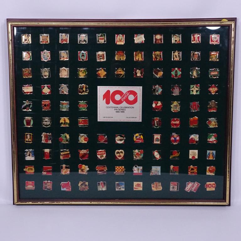 Coca-Cola Framed 100th Anniversary Pin Collection: 101 framed pins from 1986 centennial. 25 5/8" x 21.5".