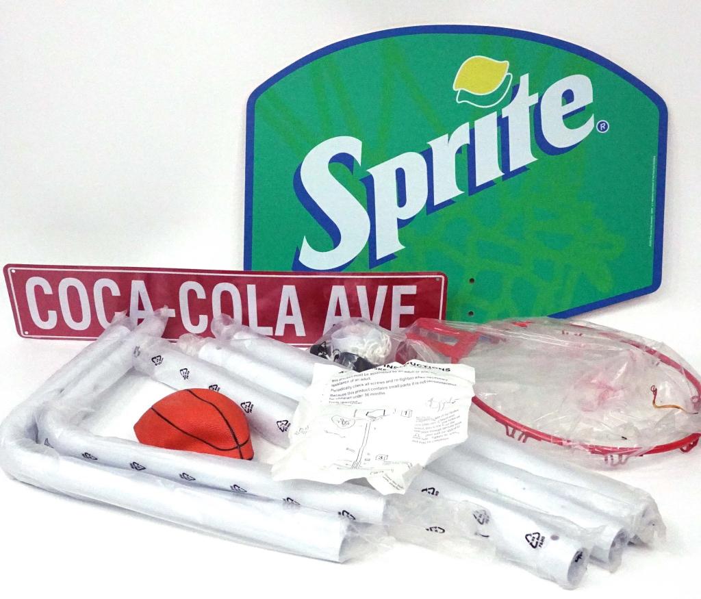 Sprite Portable Basketball Hoop, New In Box: Box: 19 x 25 x 4". Backboard: 23.5 x 17.75". 14 lbs. With new Coca-Cola Ave. sign (1996). Anticipated sale time for this lot: 8:20pm, CST.