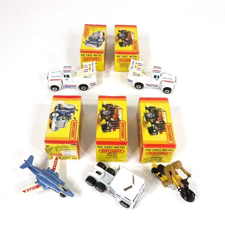 Assortment of Vintage (82)-Die-Cast-Matchbox Cars: 2 Matchbox Tyrone Malone Super Boss 66, made in England; 1 Matchbox Kenworth C.O.E Aerodyne 45, made in England; 1 Matchbox S2 Jet 02, made in England; 1 Matchbox Hondarora 18, made in England.