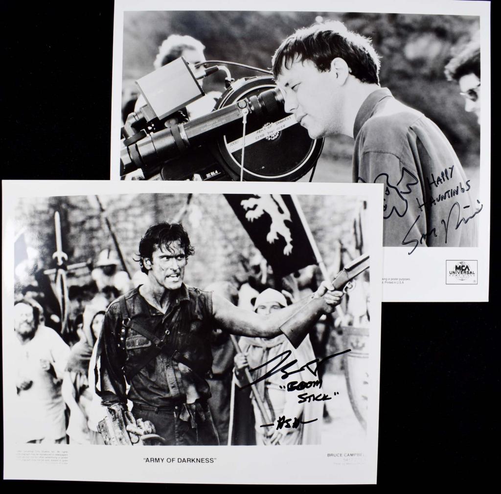 Autographs: Sam Raimi & Bruce Campbell: Two 9-15/16 x 7 15/16" black and white promotional photos from the film "Army of Darkness". Campbell's is inscribed "Boom Stick" - Ash. Raimi's is inscribed "Happy haunting" with a hand drawn picture 