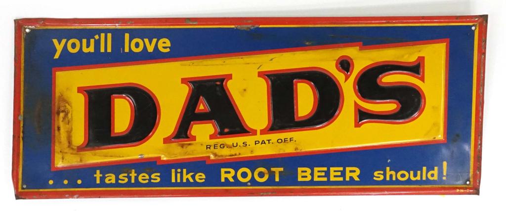 Dad's Root Beer Metal Advertising Sign: Some stains and rust. Some paint wear on "A". Sign is bent. 30 3/4 x 11 3/4".