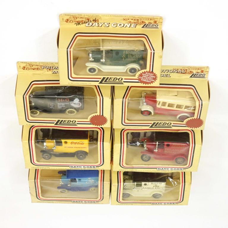 7 Die-Cast Vintage Lledo Vehicles: 1 Promotional Model Happy Days Bus, 1983. Made in England; 1 Days gone Coca-Cola Car, 1983. Made in England; 1 Promotional Model 40th Anniversary HG Car, 1983. Made in England; 1 Days Gone Rescue Comp