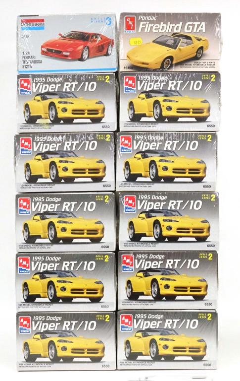 12 Vintage Model Cars: 1 Monogram Ferrari Testarossa 512TR, 1993. 1:24 Scale. Made in the U.S.A; 1 AMT ERTL Pontiac Firebird GTA, 1991. 1/25 Scale. Made in the U.S.A; 10 AMT ERTL 1995 Dodge Viper RT/10, 1994. 1/25 Scale. Ma