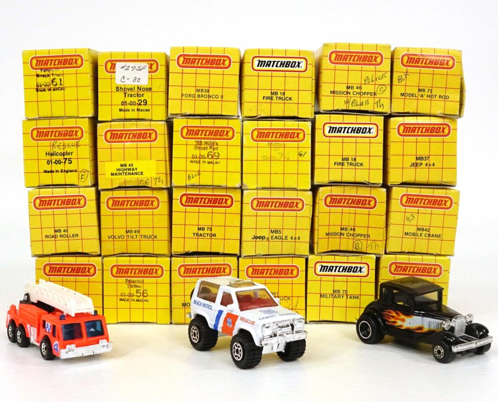 Assortment of Vintage Matchbox Die-Cast Cars: 2 MB 18 Fire Trucks, 1 MB 73 Tractor, 1 '33 Willy's Street Rod, 1 MB 45 Highway Maintenance, 2 MB 46 Mission Choppers, 1 MB61 Wreck Truck, 1 MB 73 Model 'A' Hot Rod, 1 MB73 Model "A" Ford, 1 Peterbilt