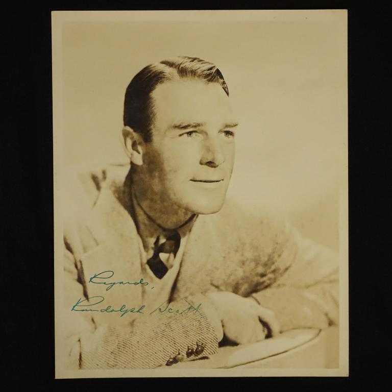 Autograph: Vintage Randolph Scott Photo: Signed vintage photo of leading western star Randolph Scott, inscribed "Regards". Randolph Scott was a key figure in westerns of the 1940s and 1950s, in addition to being the dialect coach for his fri