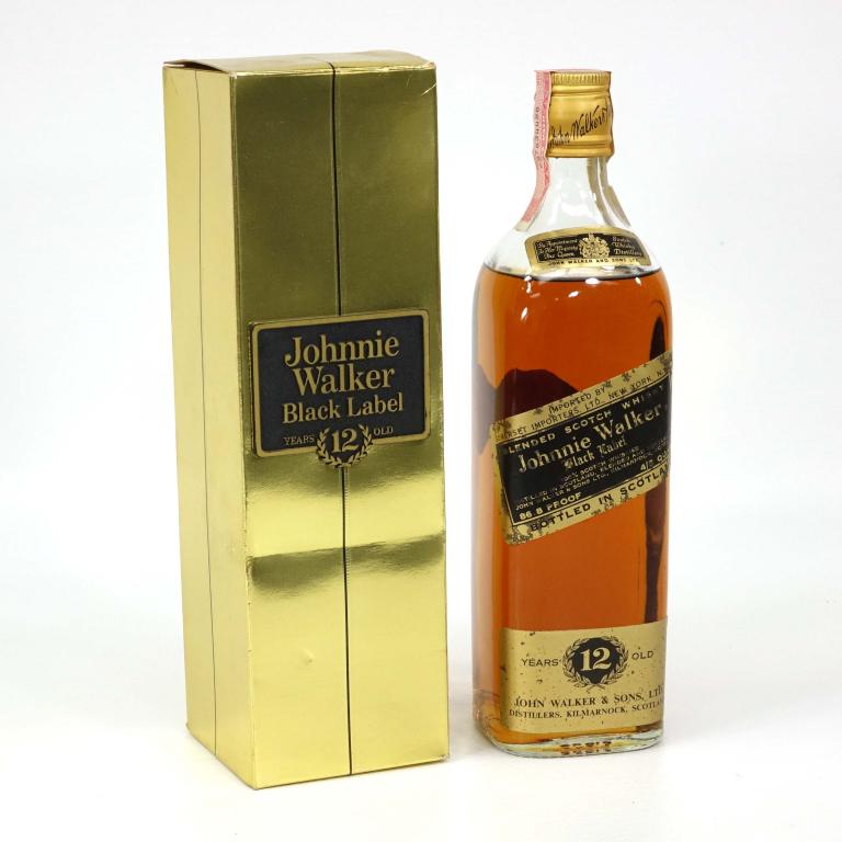 Bottle: Johnnie Walker Black - in Box: *** If shipping is needed, please call Ian at Lot 14 BEFORE bidding ***.In gold box with plaque. If you may need shipping on bottles, you MUST talk to Ian before bidding.
