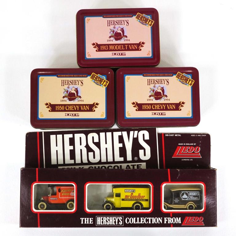 Assorted Hershey's Vehicles Lot: (1) Lledo Hershey's Collection 3 Vehicle Set - Reese's Pieces, Mr. Goodbar, Hershey's Kisses die-cast metal, Made in England, 1983; (2) Ertl 1950 Chevy Vans in display tins, 1994; (1) Ertl 1913 Model 