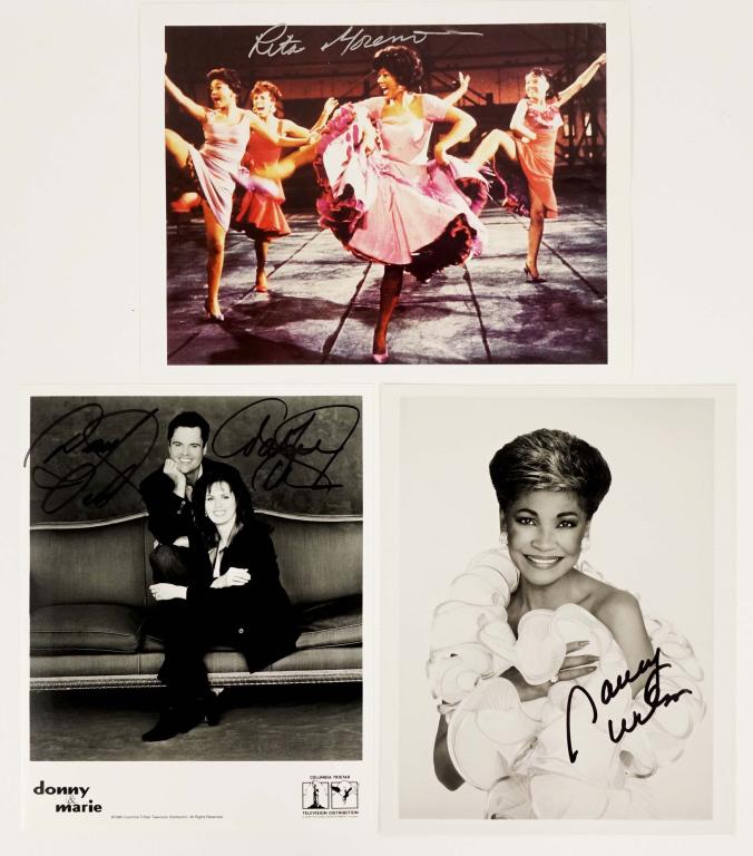 Autographs: Wilson, Osmond, Moreno: Nancy Wilson, Donny & Marie Osmond, Rita Moreno photo from West Side Story. ** Lot 14 Auctions makes the following guarantee: If either Professional Sports Authenticator (PSA) or Beckett Global, or Ja