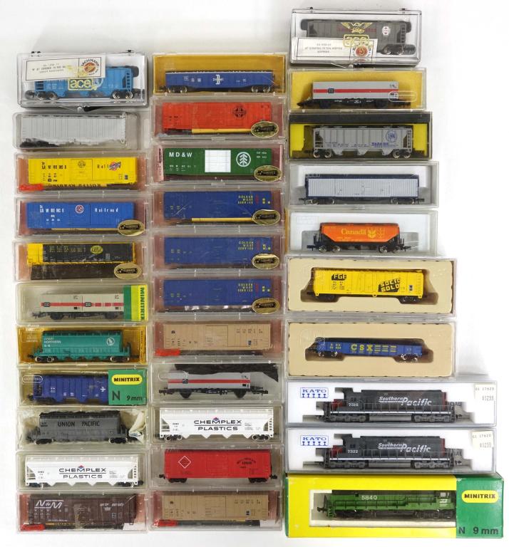 32 Assorted Sizes Model Train Cars: 11 Roundhouse, 5 Minitrix, 4 Kato, 2 Ahm Minitrains, 2 Ace, 2 Con-Cor, 1 Life-Like, 1 Kadee Microtrains, 2 ModelPower, 1 Bachmann, 1 unspecified brand.