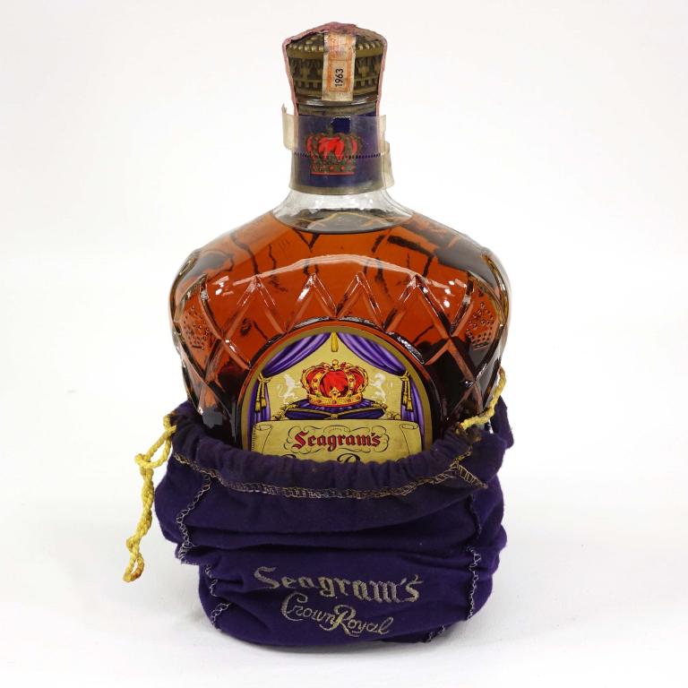 1963 Crown Royal 1/2 Gallon: 86 Proof, in bag. Bag is in rough condition. If you anticipate needing bottles shipped you MUST talk to Ian PRIOR to BIDDING! 847-625-0555.