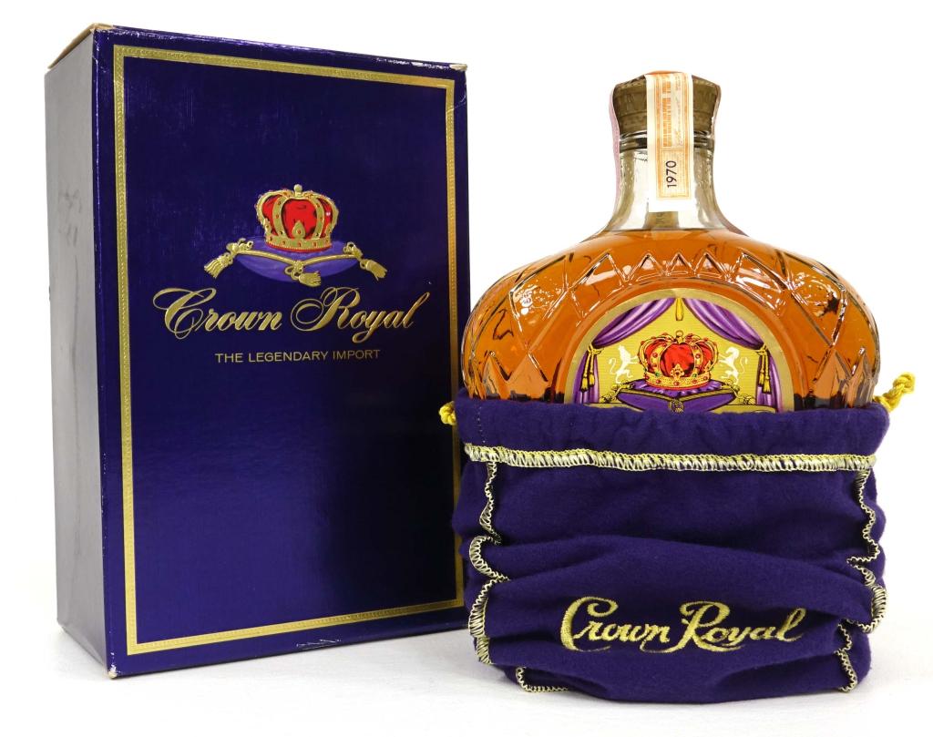 1970 Crown Royal Bottle: With bag and box, both in excellent condition. 750ml. If you anticipate needing bottles shipped you MUST talk to Ian PRIOR to BIDDING! 847-625-0555.