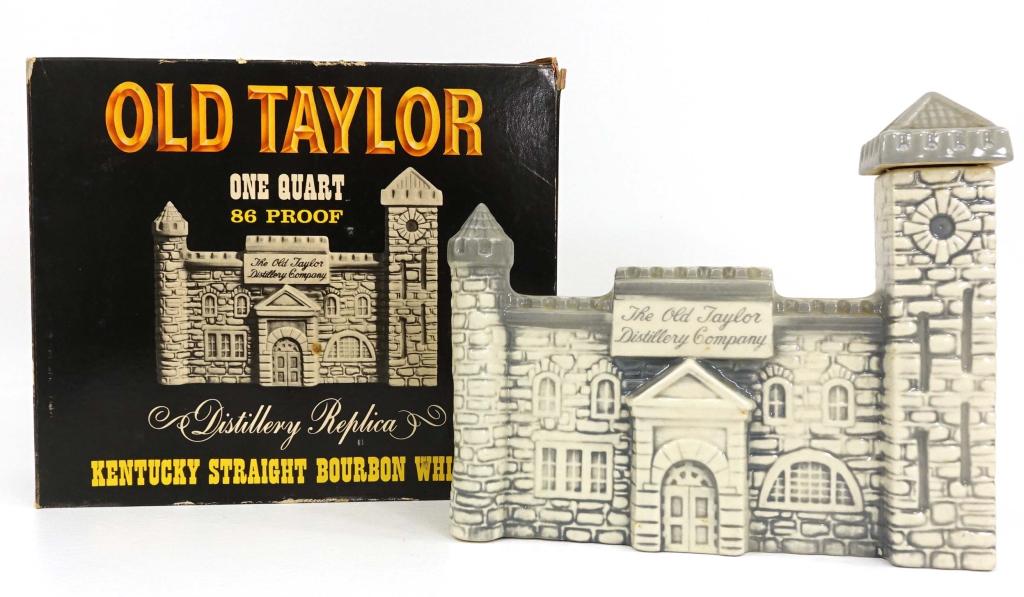 Old Taylor Whiskey Distillery Replica Decanter: 1 quart. 86 proof, in box. If you anticipate needing bottles shipped you MUST talk to Ian PRIOR to BIDDING! 847-625-0555.The seal is intact, and based on a non-scientific sloshing, it feels ½ - ¾ fu