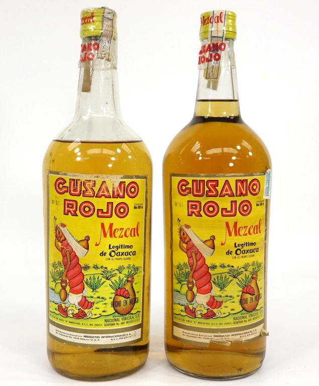 2 Mezcal Tequila Bottles - Cusano Rojo: 1 liter each. 1 bottle has high shoulder fill, other bottle has good fill to neck. Each one has 1 worm. If you anticipate needing bottles shipped you MUST talk to Ian PRIOR to BIDDING! 847-625-0555.