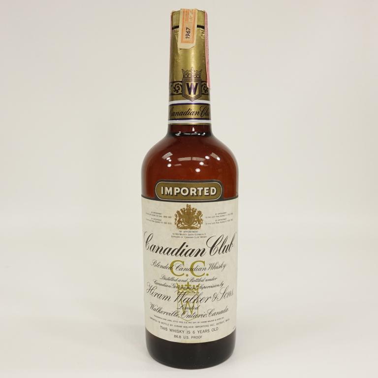 Bottle: Canadian Club: 1967, 86.8 proof, 4/5 quart, sealed. If you anticipate needing bottles shipped you MUST talk to Ian PRIOR to BIDDING! 847-625-0555.