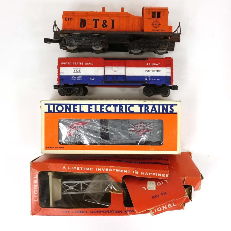 Train Lot: DT&I locomotive. Lionel Redwing Shoes boxcar 6-16264, in box. Post Office boxcar - Lionel. Lionel Flood light tower (#195) in damaged box.