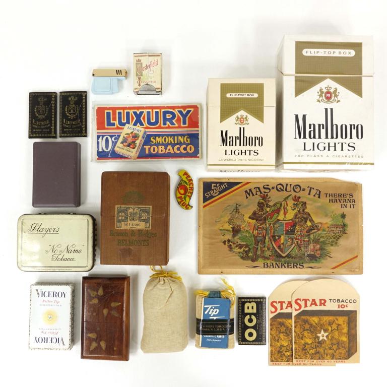 Vintage Tobacco, Cigar, Ashtray & Sundries: Lighters & Rolling Paper - Polly baby blue plastic gun lighter 2" x 1.5". Lucienne lighter with Carlton branding. New in box with paperwork. Two packs of R.J. Reynolds OCB rolling paper (150 leaves). 