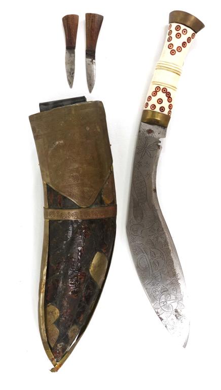 Khukuri - Nepalese Fighting Blade; Great Engraving: Gurkha Fighting Knife - From tip to hilt is 15.25" long. Some damage to hilt, missing inlay. Blade depicts a scene of a serpent like creature on one side and a bird and the sun on the other. Damage to