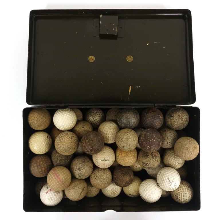 57 Antique & Vintage Golf Balls: Some with square or round divots. Including (of the readable balls): Penfold; A&F Co. Monogram; Augusta 1; Spalding; Spalding 50; Niagara; Eagle; Saratoga liquid center; Bell & Howell - Midwest Visual
