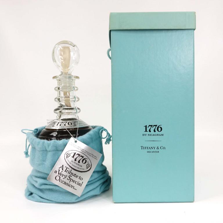1776 Whiskey Decanter, Seagram: *** IF YOU MAY NEED SHIPPING YOU MUST CALL IAN BEFORE BIDDING ON BOTTLES *** Sealed, in Tiffany & Co. bag and box, with literature. 4/5 quart, 80 proof.