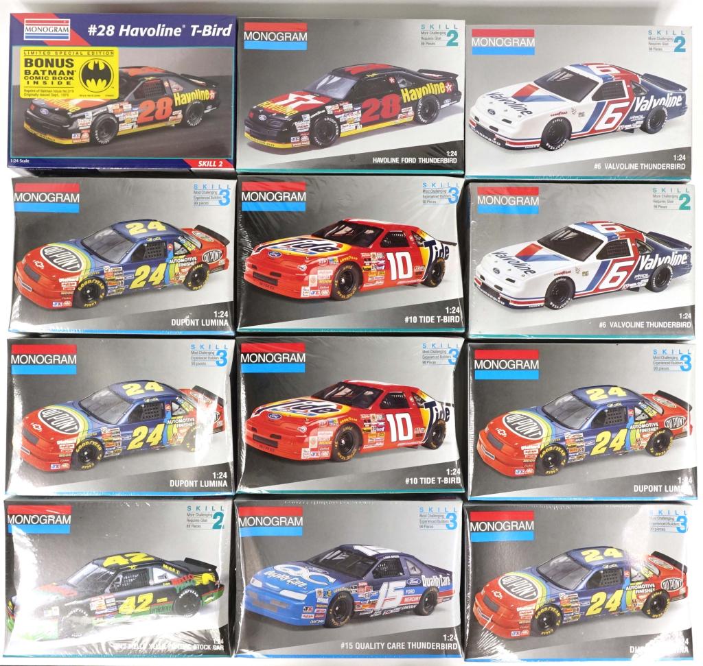 12 Monogram Race Car Kits (SEALED!): All 1:24 scale and SEALED in original shrinkwrap. Some boxes dented/caved. Including DuPont and T-Bird with Batman comic book inside.