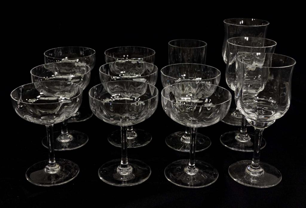 Assortment of Baccarat Drinking Glasses: 8 champagne glasses, 3 wine (Rosé) glasses, weighted water glass. In white case, 15.5 x 11.5 x 9.5.