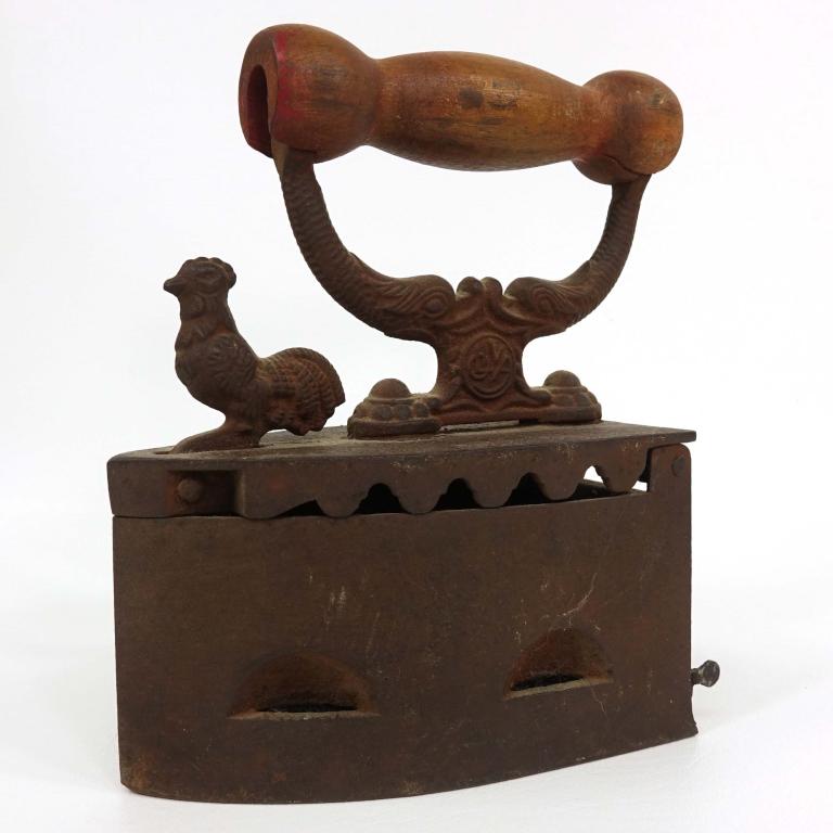 Oliva Rooster Cast Iron Sad Clothes Iron: Coal heated cast iron with rooster latch. Inside stamps S. Joad de Madeira. Red paint is largely faded from handle.