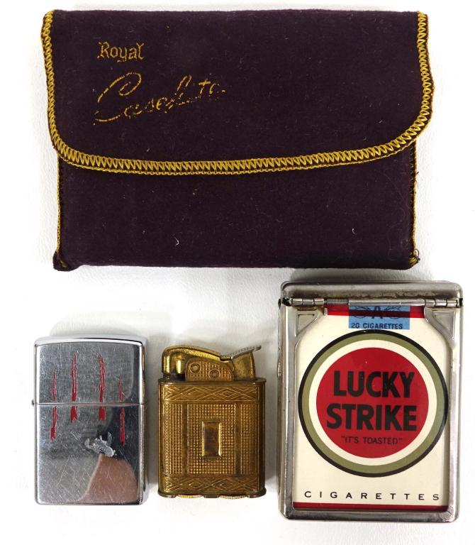 Cigarette Cases and 2 Lighters: Royal Case-Lite with bag. Lucky Strike sealed case in a hold-a-pak case. Zippo, Evans lighters.