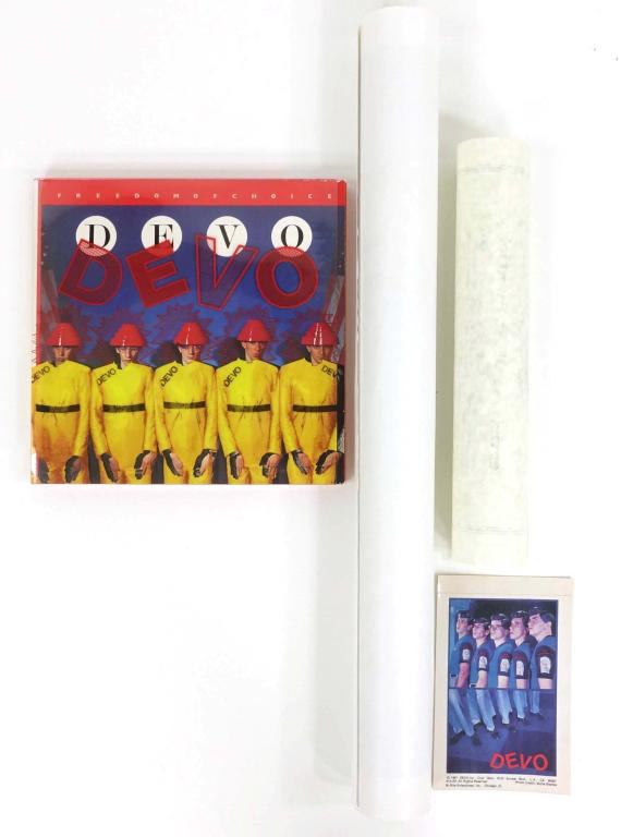 Devo Lot (incl. signed poster): Devo Signed Poster! In original shipping tube. Ultra Devo-Lux Ltd. Edition Warner Bros. CD and vinyl set! Unsure if complete. And a little vintage 1981 Devo picture/sticker. ** Lot 14 makes the follow