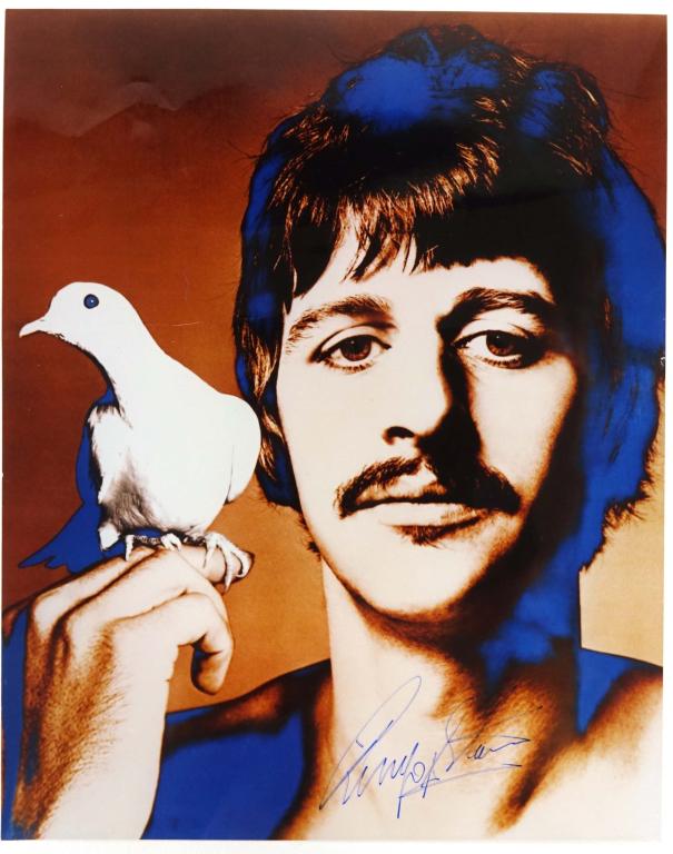 Ringo Starr Autograph - Signed Photo: Dove perched on right hand. 8" x 10". *** Lot 14 makes the following guarantee: If either Professional Sports Authenticator (PSA) or Beckett Global, or James Spence Authentication (JSA) reviews this a