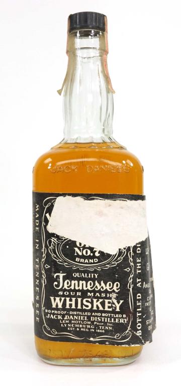 Jack Daniel's Bottle: *** If shipping is needed, please call Ian (847-625-0555) at Lot 14 BEFORE bidding *** Bottle: 750 ml, 90 proof. Sealed. Label is torn and coming off of bottle.