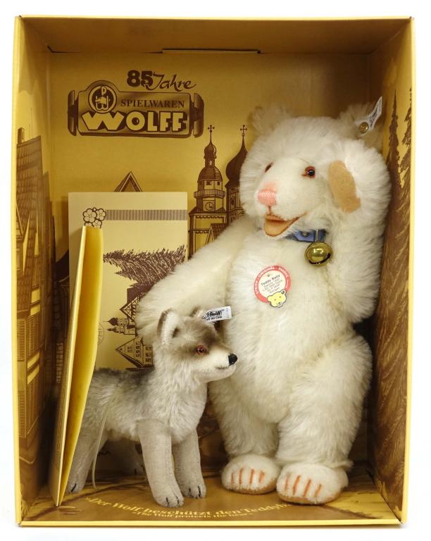 Steiff TeddyBaby and Wolf: Steiff Teddy Baby and Wolf. Made in 1988 with Genuine Mohair in Germany. Excellent condition with original box and certificate. 14in. X 11in.