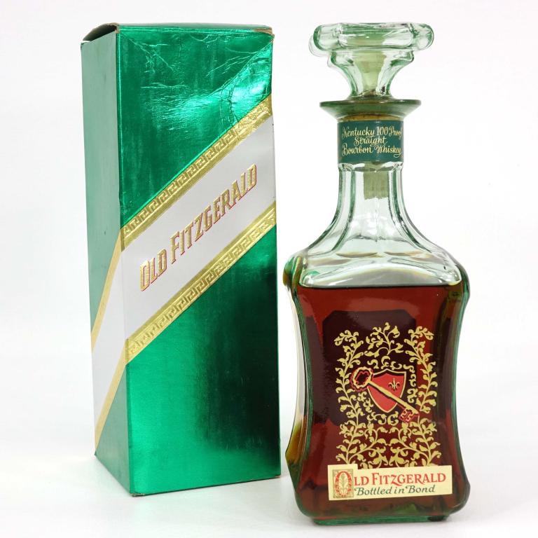 1973 Old Fitzgerald Bottled in Bond Decanter: ***IF YOU MAY NEED SHIPPING YOU MUST CALL BEFORE BIDDING ON BOTTLES! 847-625-0555*** Decanter: 1973 Old Fitzgerald Bottled in Bond Hospitality Decanter in green box. 6 year, 100 proof. ***BROKEN SEAL*
