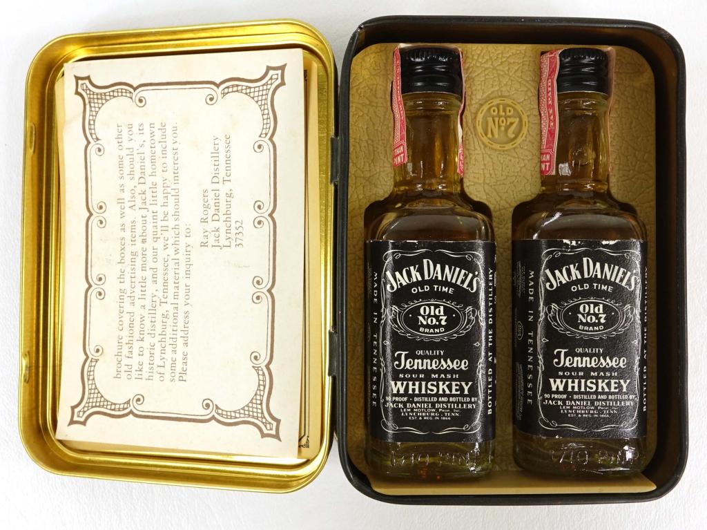 Two Jack Daniel's Mini Bottles in Tin Box: ***IF YOU NEED SHIPPING ON BOTTLES, PLEASE CALL US BEFORE YOU BID. 847-625-0555.*** Two Jack Daniel's Mini Bottles in original tin box. 90 proof, 1/10 pint, and sealed.