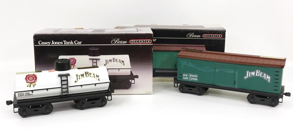 2 Jim Beam Train Car Decanters: In box. Casey Jones Box Car, Casey Jones Tank Car. IF YOU MAY NEED SHIPPING YOU MUST SPEAK WITH IAN BEFORE BIDDING ON BOTTLES.